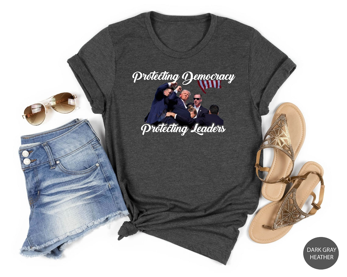 Trmp Flght T-shirt, Trmp Suicide Attempt, Never Surrender Shirt, Trmp Shooter, Anti Biden Shirt, Rally Protection,News Event Shirt
T-shirt & Hoodie