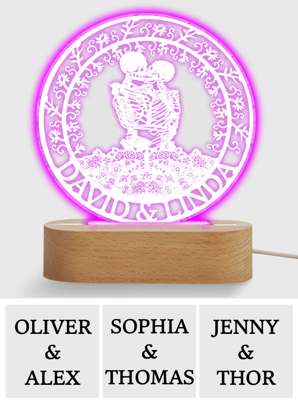 Couple de squelettes s'embrassant avec des roses - Plaque lumineuse personnalisée en forme de crâne