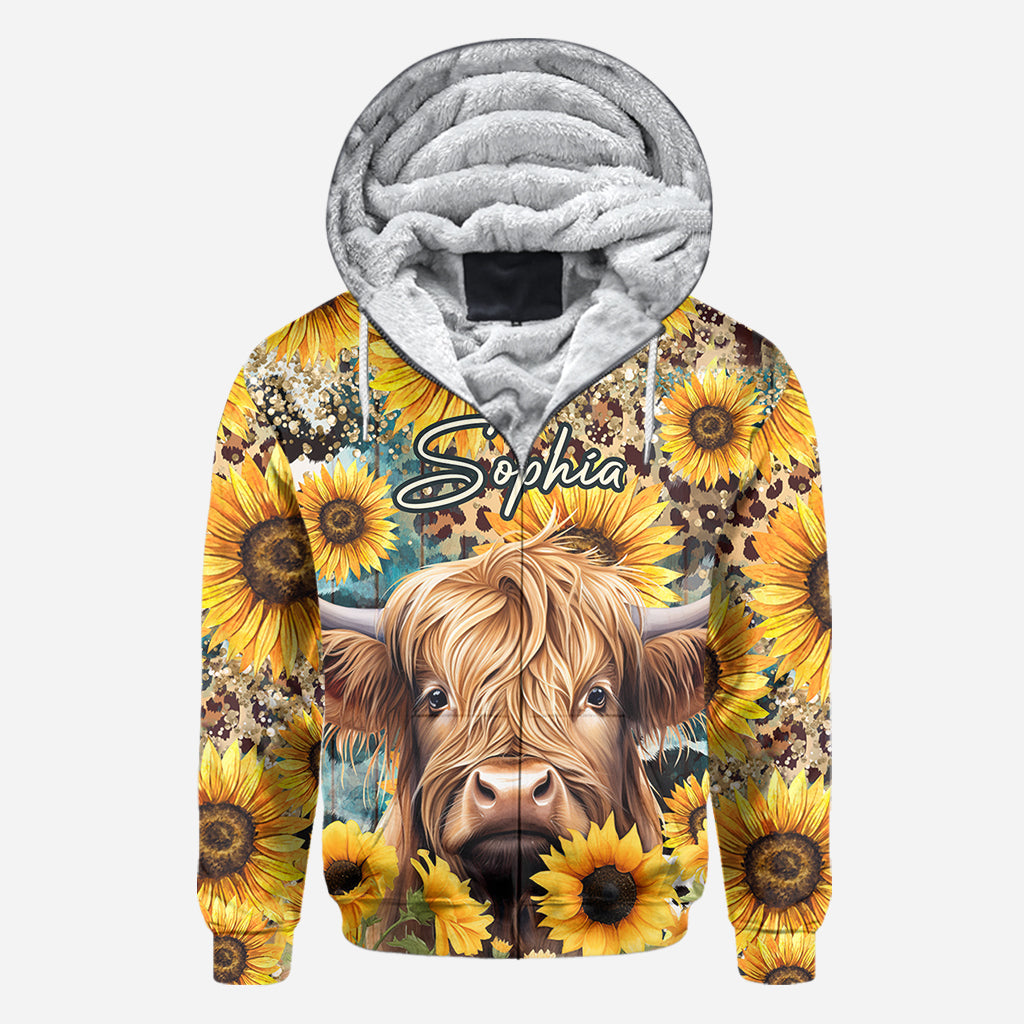 T-shirt personnalisé intégral représentant une vache des Highlands parmi des tournesols
