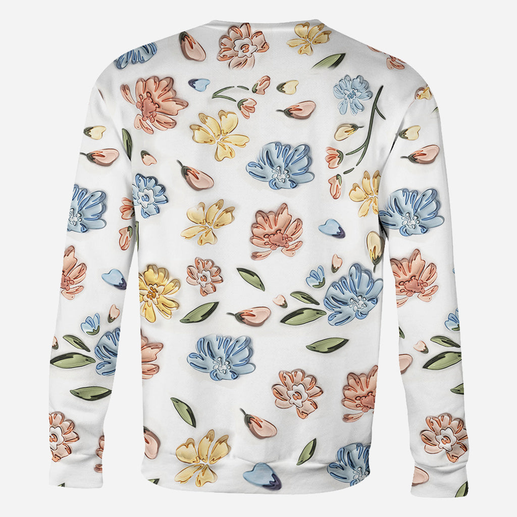 T-shirt personnalisé « Mains de maman tenant des fleurs pastel » avec motif floral pastel