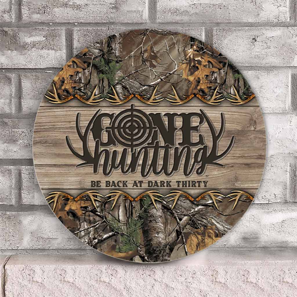 Panneau rond en bois « Parti chasser »