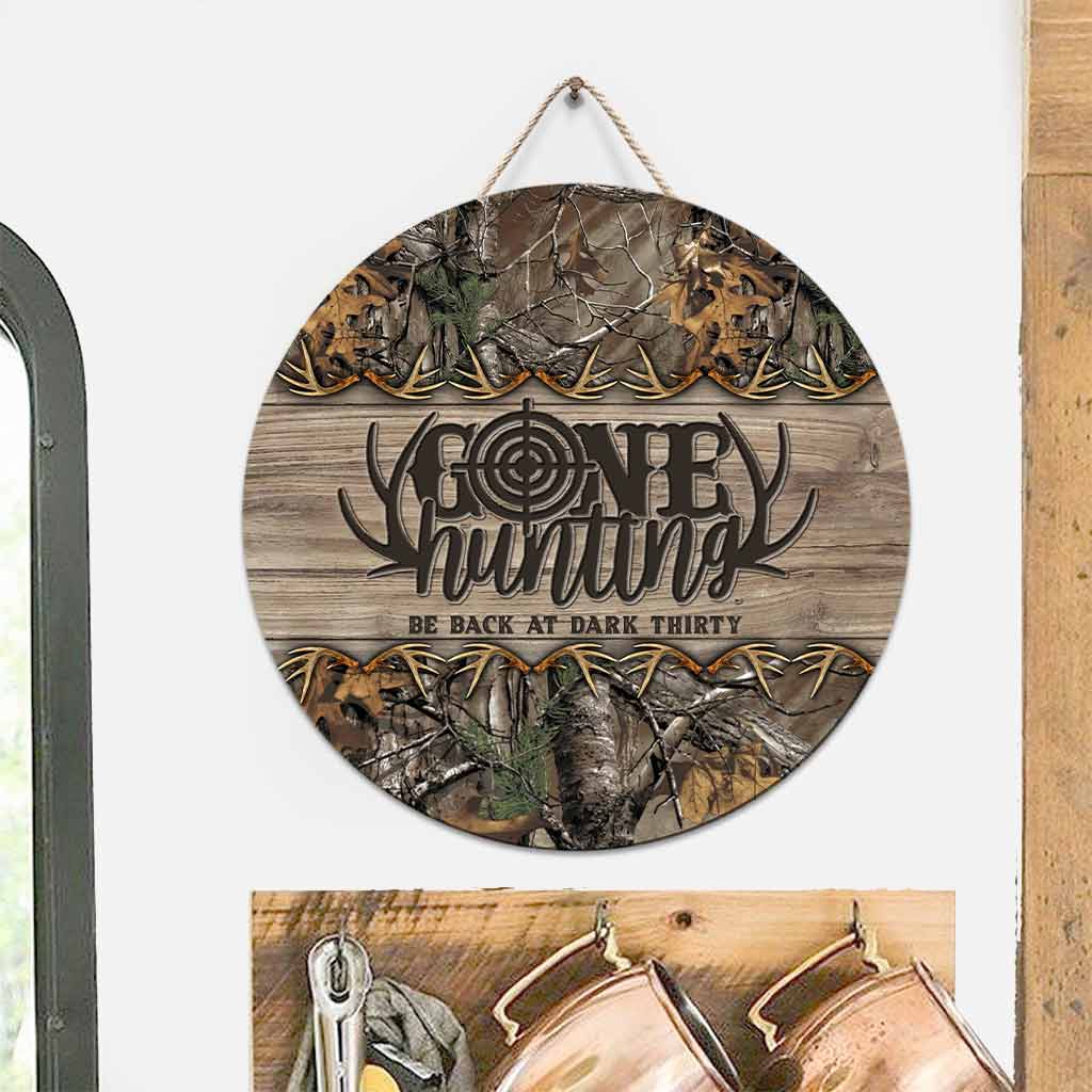 Panneau rond en bois « Parti chasser »