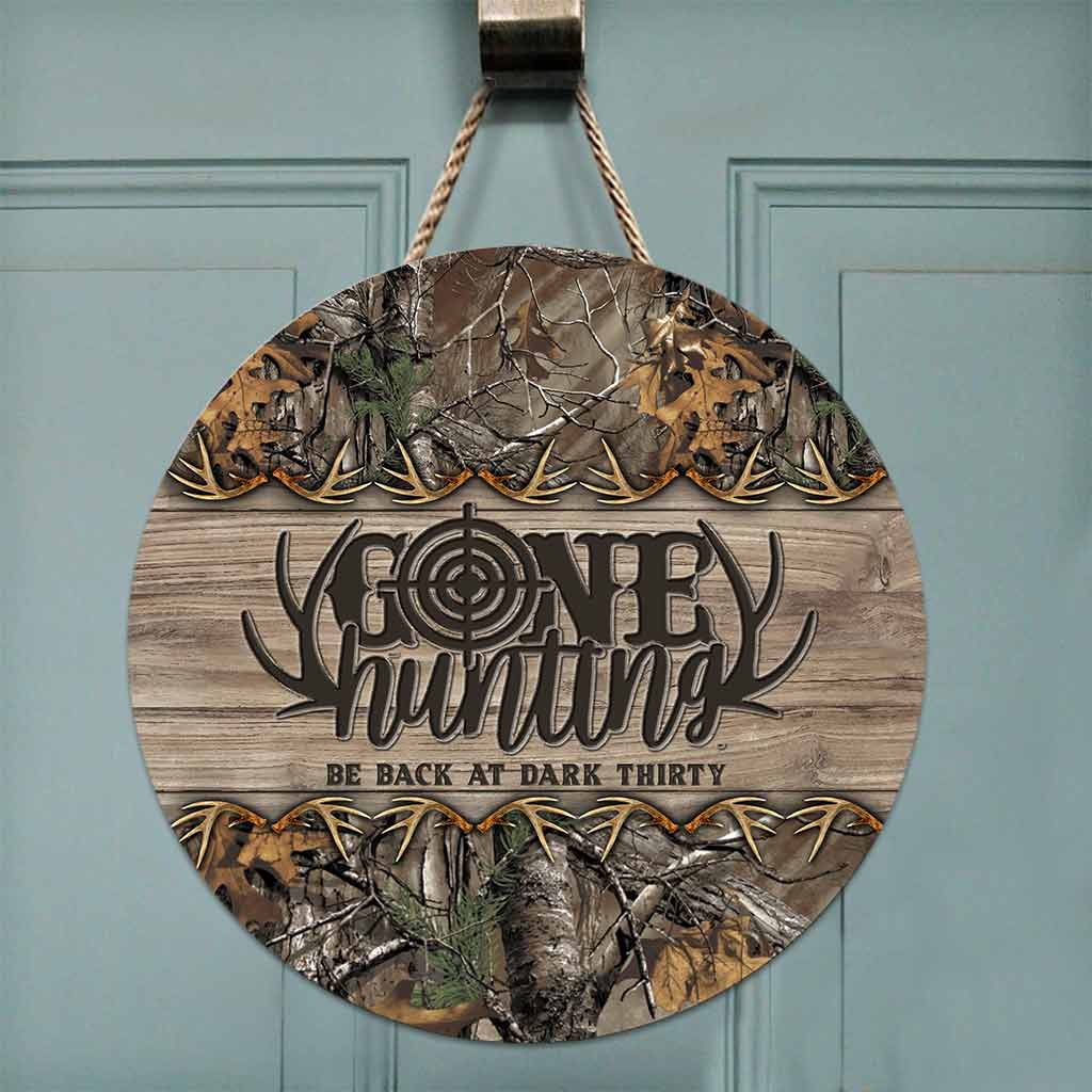 Panneau rond en bois « Parti chasser »