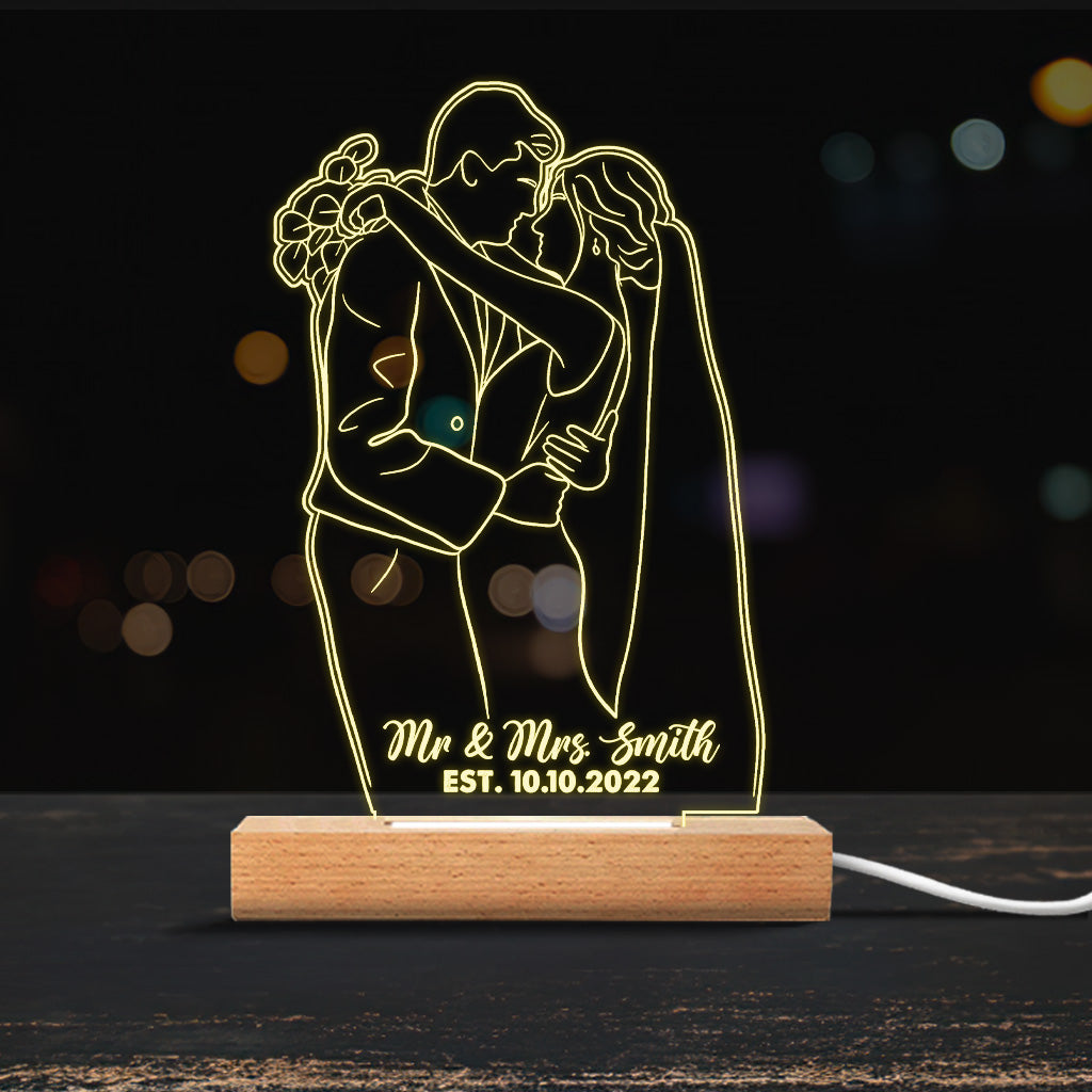 Socle lumineux personnalisé en forme de couple avec dessin au trait
