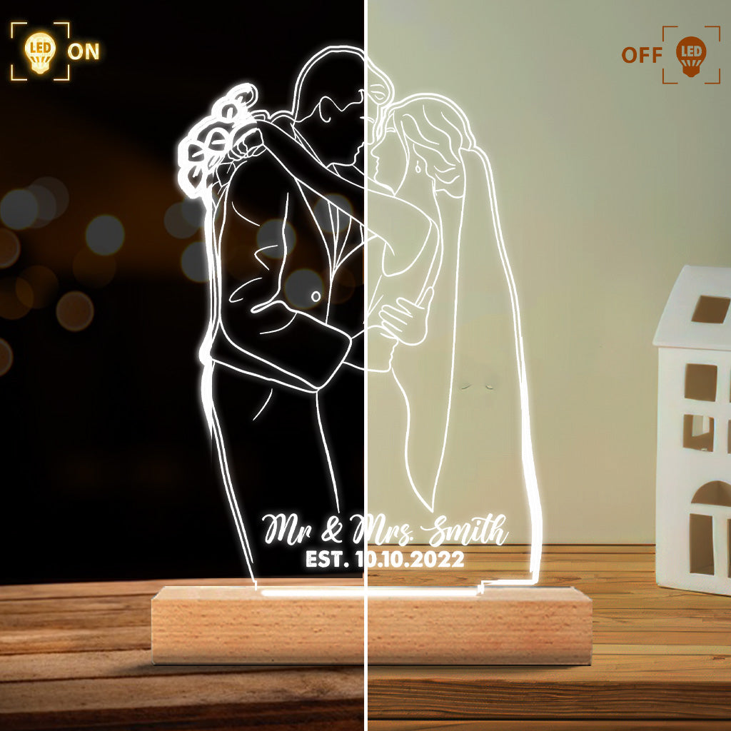 Socle lumineux personnalisé en forme de couple avec dessin au trait
