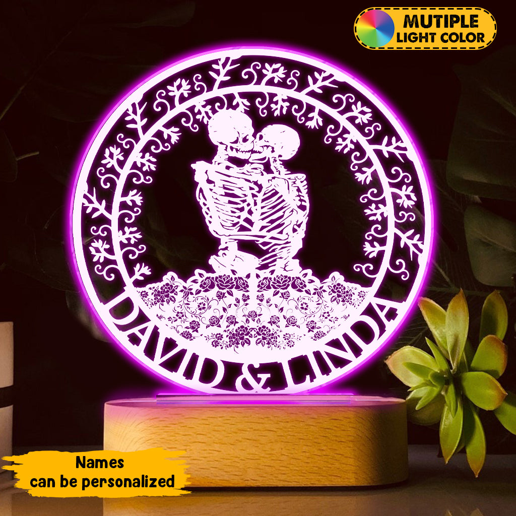 Couple de squelettes s'embrassant avec des roses - Plaque lumineuse personnalisée en forme de crâne